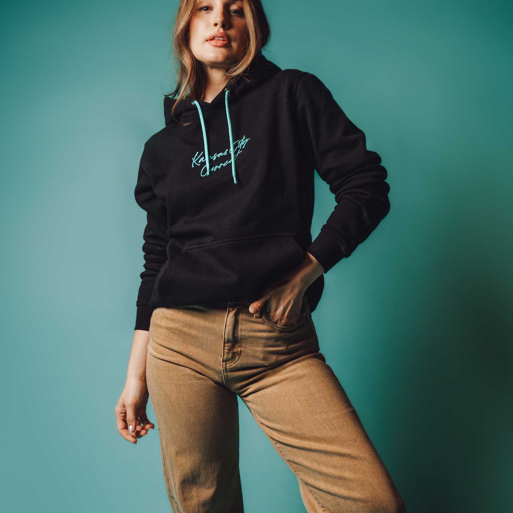 Unisex Black Teal Script Hoodie on Model