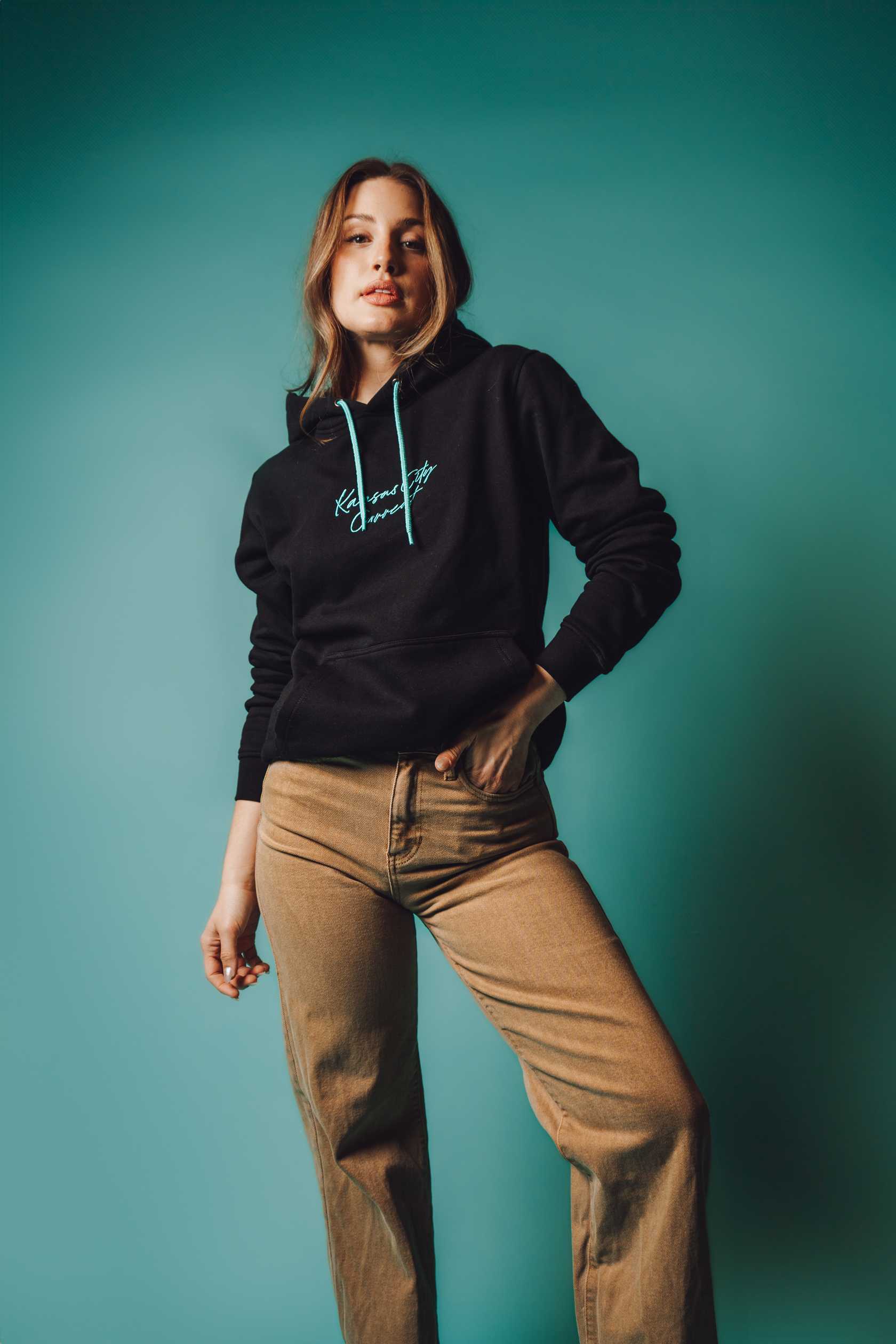 Unisex Black Teal Script Hoodie on Model